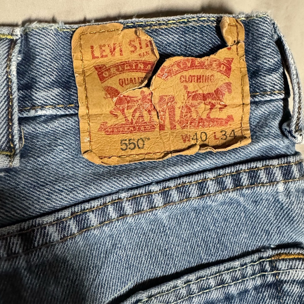 Levi's 550 Relaxed Fit Jeans in Light Blue Denim with Tan Patch
